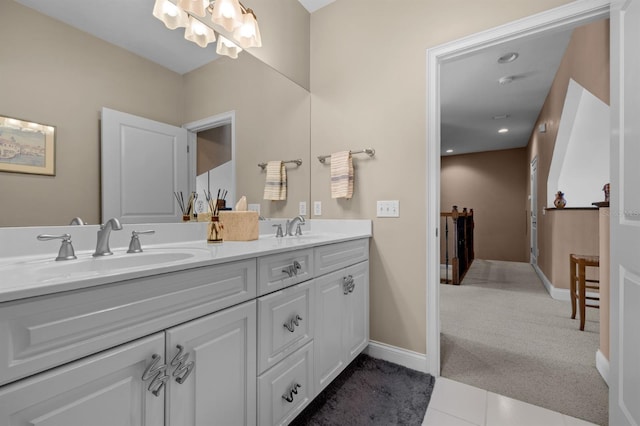 bathroom featuring tile patterned flooring and vanity