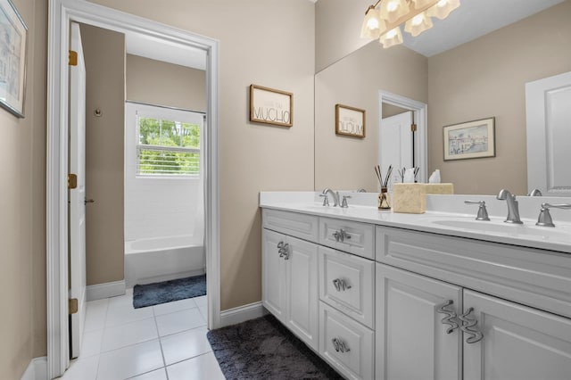 bathroom with tile patterned flooring, double sink vanity, and washtub / shower combination