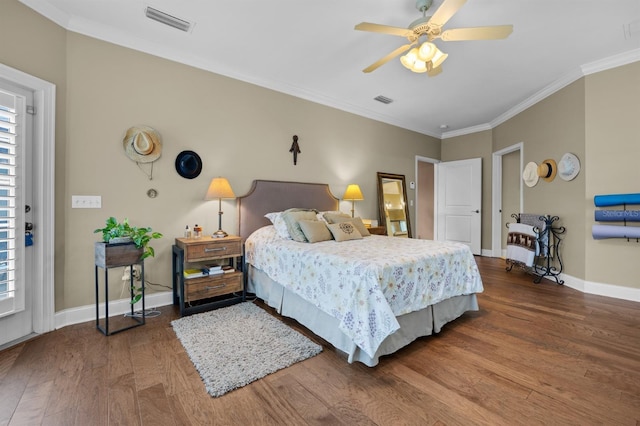 bedroom featuring crown molding, hardwood / wood-style flooring, and ceiling fan