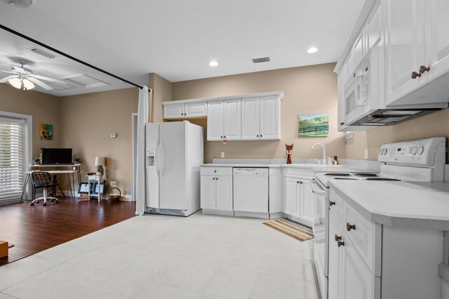 kitchen featuring sink, white cabinetry, white appliances, light hardwood / wood-style floors, and ceiling fan