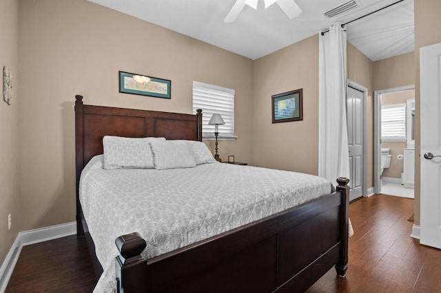 bedroom with dark hardwood / wood-style floors and ceiling fan