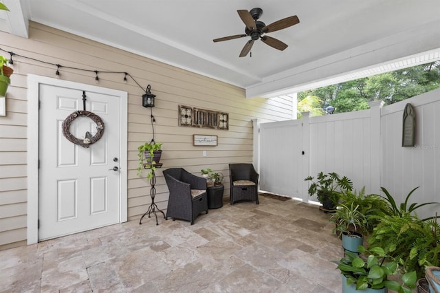 property entrance featuring ceiling fan