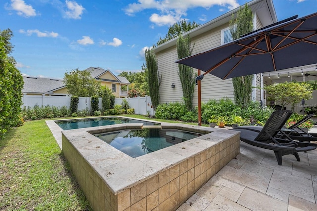 view of pool featuring a patio area and an in ground hot tub