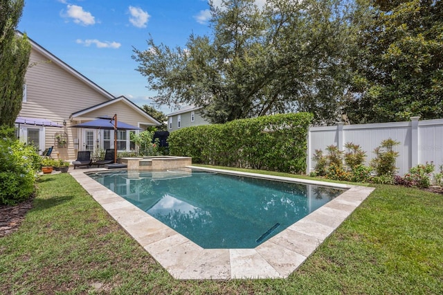 view of pool featuring a yard