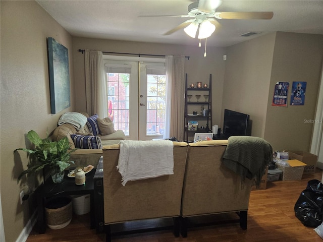 living room with french doors, hardwood / wood-style floors, and ceiling fan