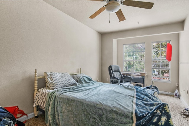 bedroom featuring carpet, baseboards, and ceiling fan