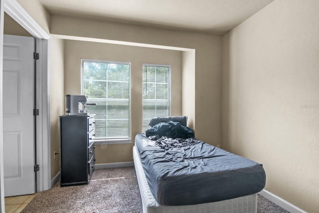 carpeted bedroom with baseboards
