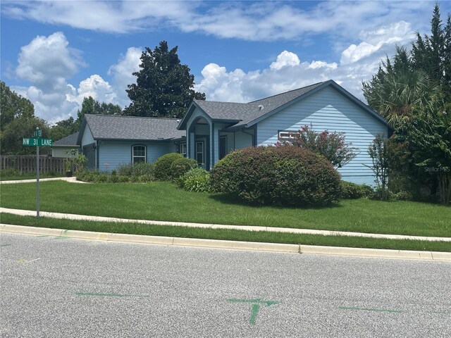 view of front of home with a front lawn