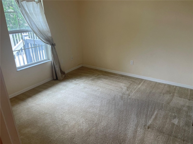 spare room featuring carpet flooring