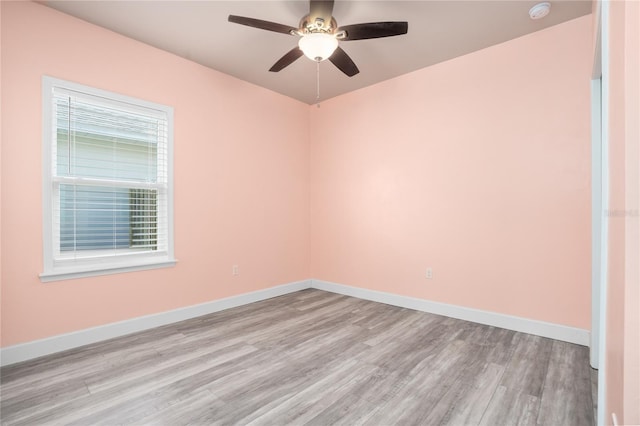 unfurnished room featuring ceiling fan and light hardwood / wood-style floors