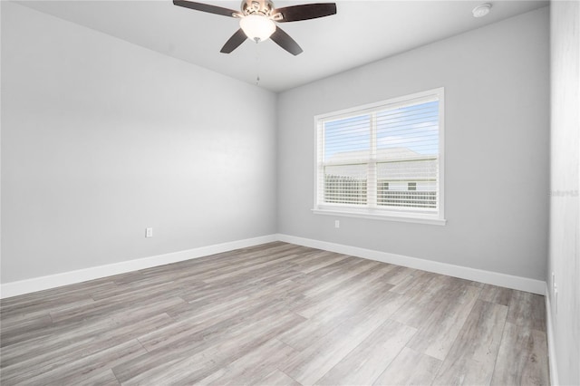 empty room featuring ceiling fan and light hardwood / wood-style floors