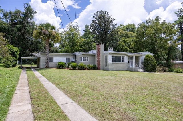 ranch-style house with a front yard