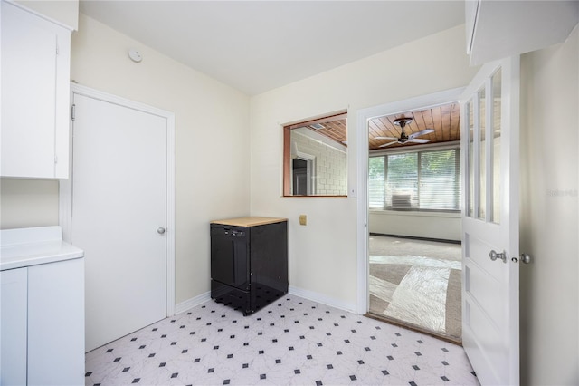 bathroom with ceiling fan, baseboards, and tile patterned floors