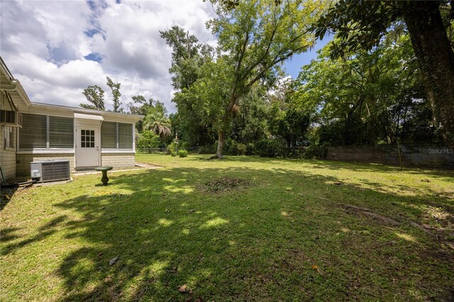 view of yard featuring central AC unit