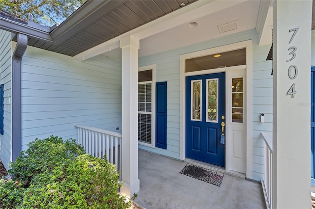 doorway to property featuring a porch