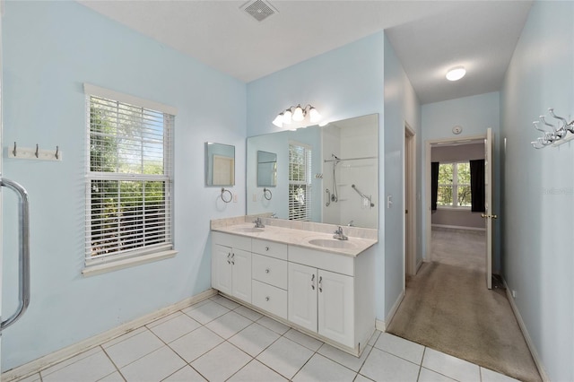 bathroom featuring double vanity and tile patterned floors