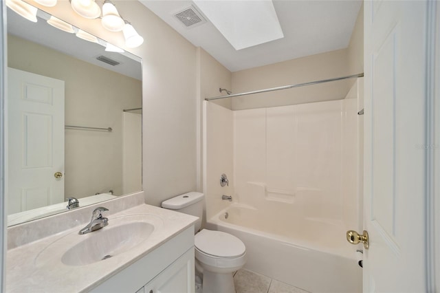 full bathroom featuring shower / bath combination, toilet, tile patterned flooring, a skylight, and vanity