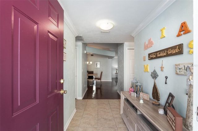 entryway featuring light hardwood / wood-style floors and crown molding