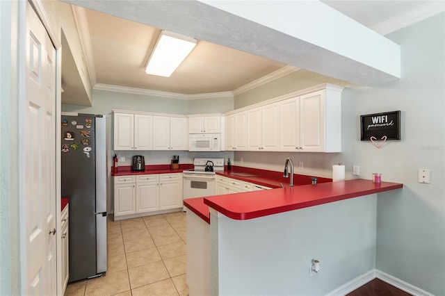 kitchen featuring kitchen peninsula, white appliances, white cabinets, and ornamental molding