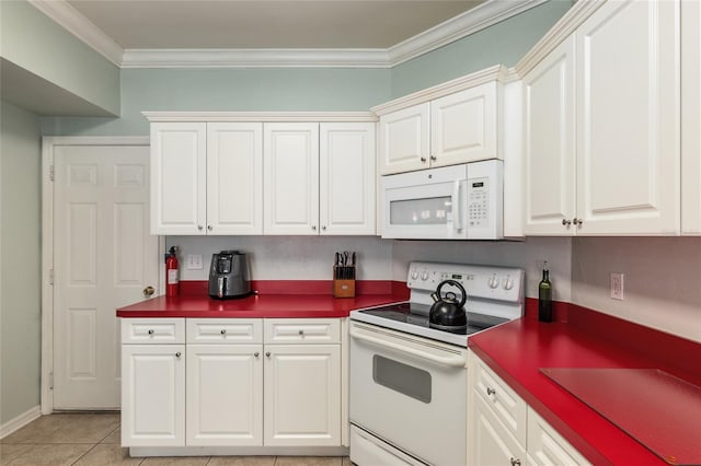 kitchen featuring white cabinetry, crown molding, light tile patterned flooring, and white appliances