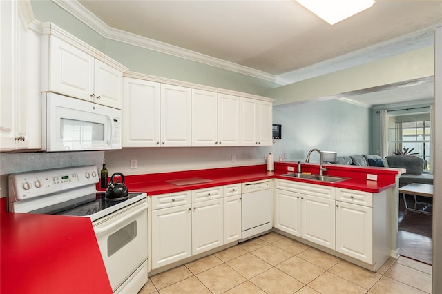 kitchen with sink, kitchen peninsula, white appliances, and ornamental molding