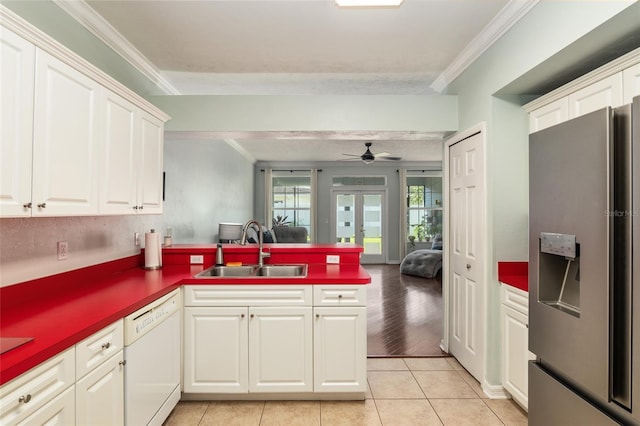 10545 NW 30th Ln, Gainesville, FL 32606 - kitchen featuring ornamental molding, a sink, white dishwasher, a peninsula, and stainless steel refrigerator with ice dispenser