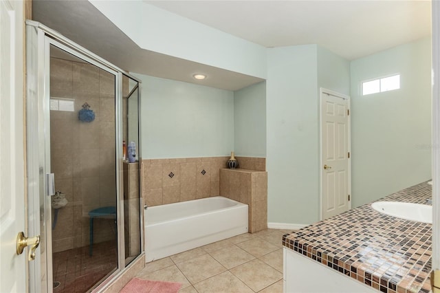 10545 NW 30th Ln, Gainesville, FL 32606 - full bathroom with tile patterned floors, a garden tub, vanity, and a stall shower
