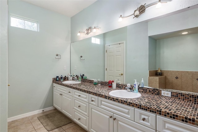 bathroom with dual vanity and tile patterned flooring