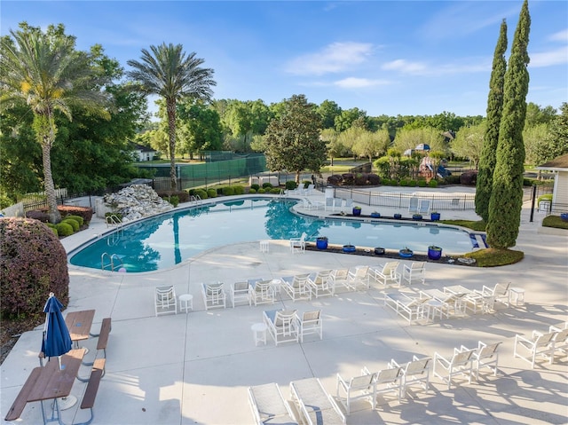 view of swimming pool featuring a patio area