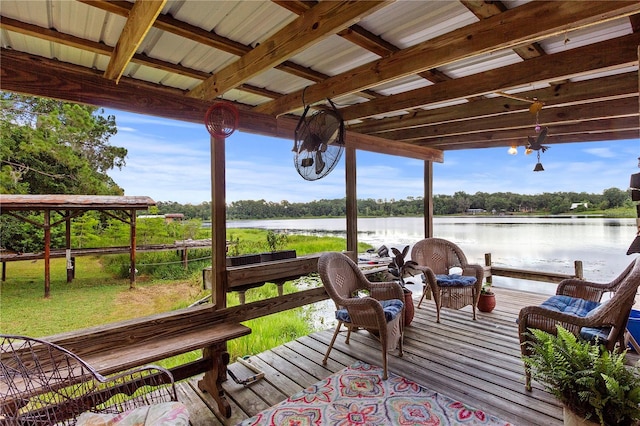 wooden terrace featuring a water view