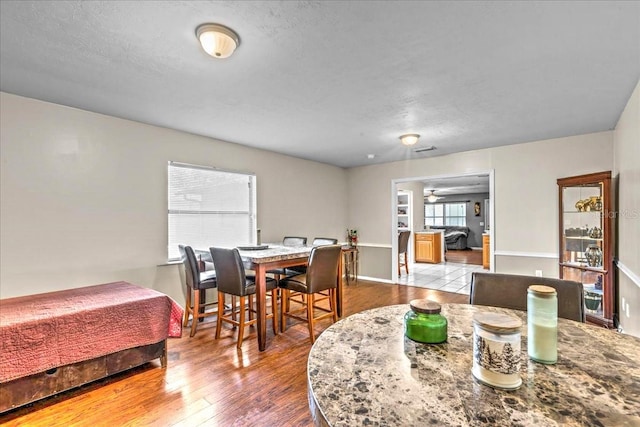 dining room featuring ceiling fan and hardwood / wood-style flooring