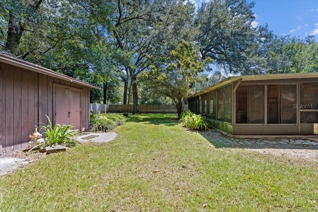 view of yard featuring a sunroom