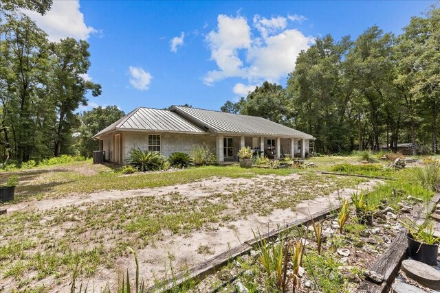 7340 NW 21st Ave, Bell, FL 32619 - view of front facade with metal roof and central AC unit