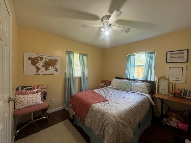 bedroom featuring ceiling fan and dark wood-type flooring