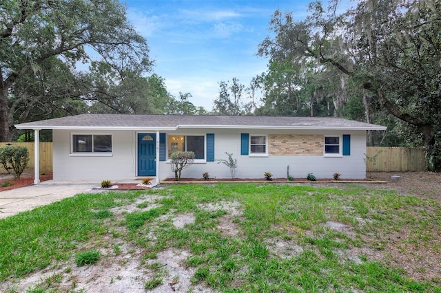 ranch-style house with a front lawn