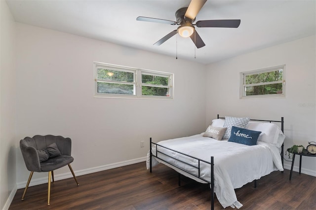 bedroom with ceiling fan and dark hardwood / wood-style floors