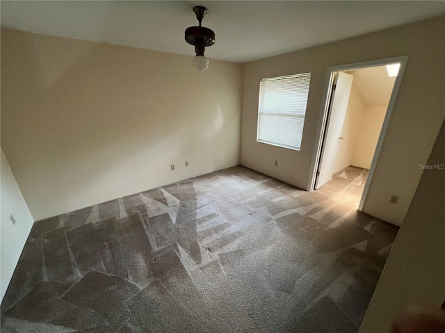 empty room featuring carpet flooring