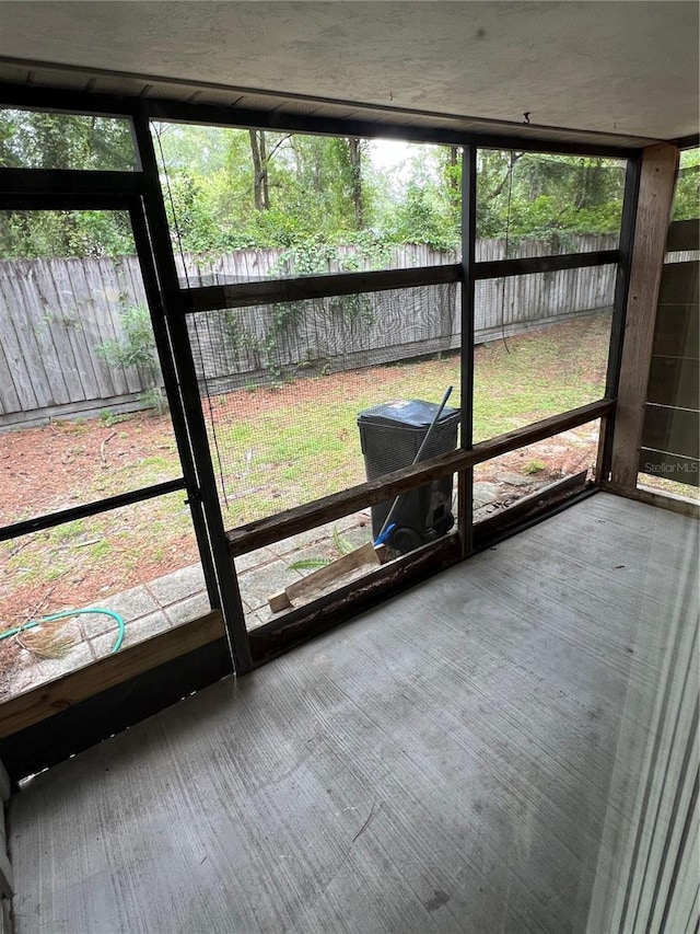 unfurnished sunroom with a wealth of natural light