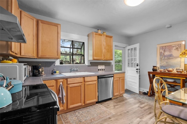 kitchen with dishwasher, light hardwood / wood-style floors, extractor fan, stove, and decorative backsplash