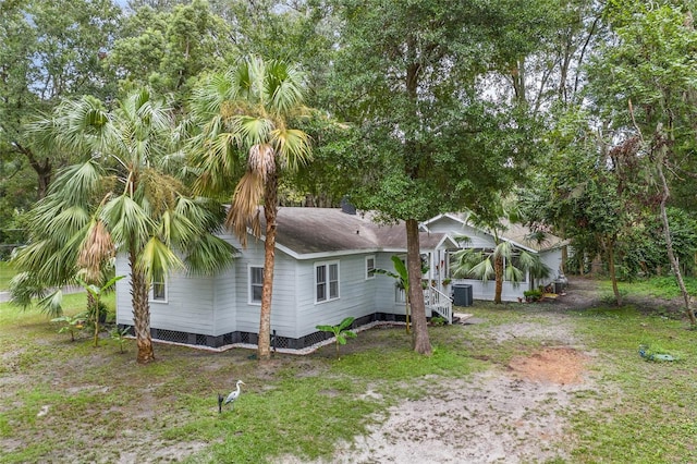 view of side of property featuring cooling unit