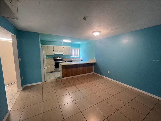 kitchen featuring white fridge, electric range, white cabinetry, light tile patterned floors, and kitchen peninsula