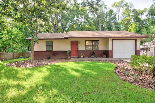 single story home with a front lawn and a garage