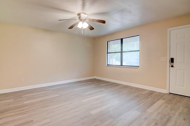 empty room with light wood-type flooring and ceiling fan