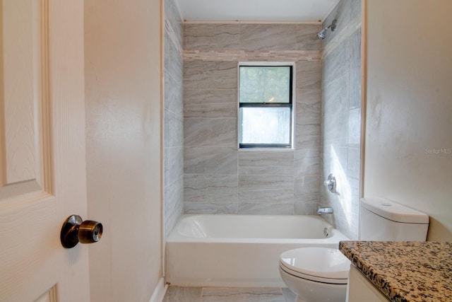 full bathroom featuring tiled shower / bath combo, tile patterned flooring, toilet, and vanity