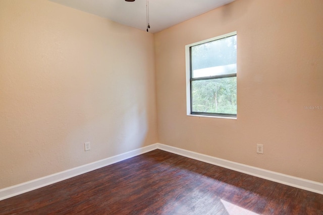 unfurnished room featuring dark hardwood / wood-style floors