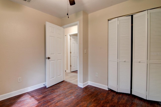 unfurnished bedroom featuring a closet, ceiling fan, and hardwood / wood-style floors