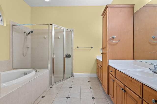 bathroom with tile patterned flooring, vanity, and separate shower and tub