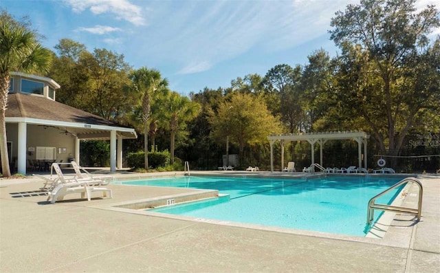 pool featuring a patio area and a pergola