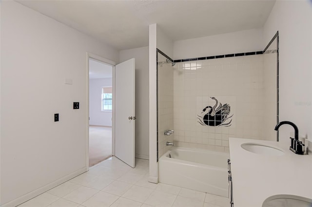 bathroom with tiled shower / bath, tile patterned flooring, and vanity