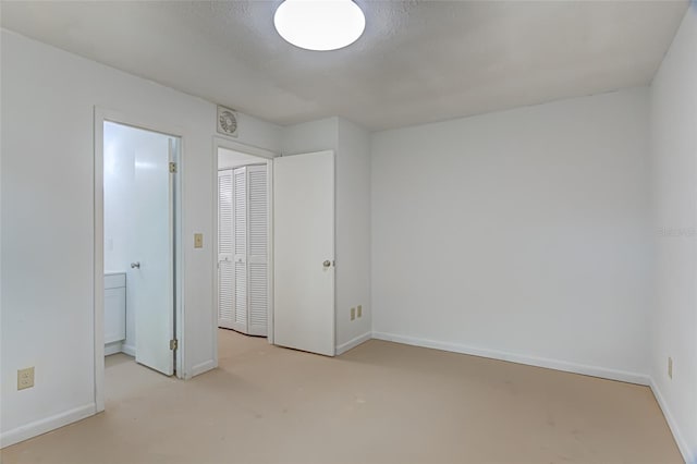 unfurnished bedroom with a closet